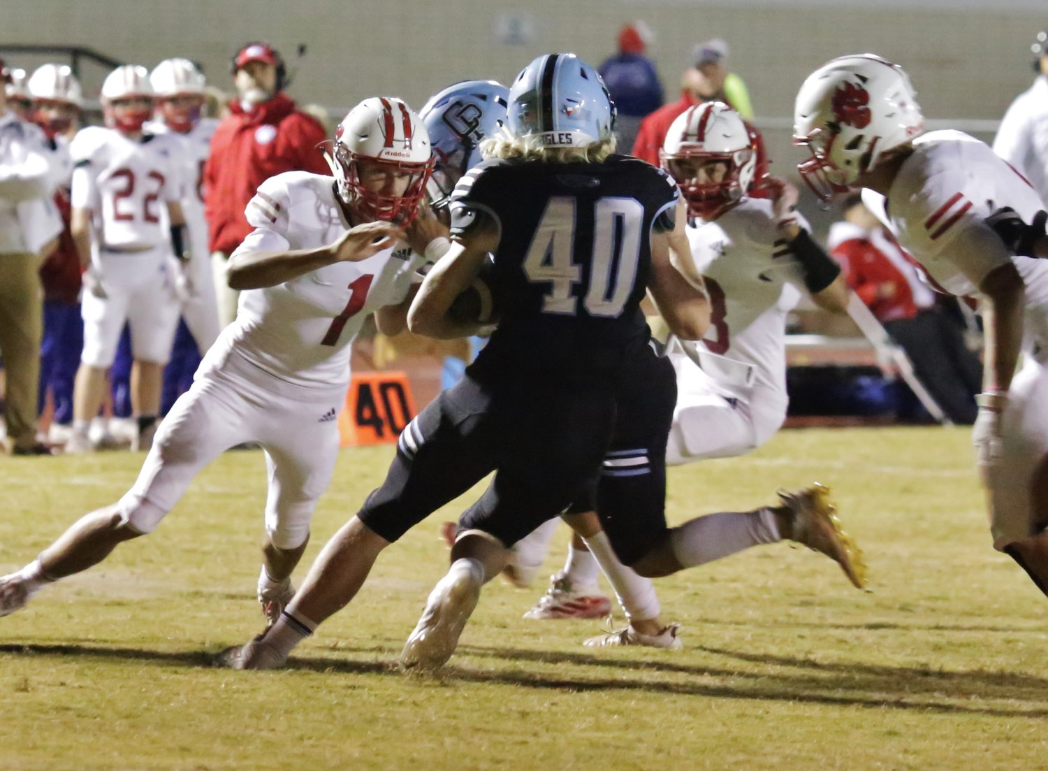 Panthers (from the left) Braylon Moffett, Nick Hallman and Jerry Skinner close in on an Eagle ball carrier.